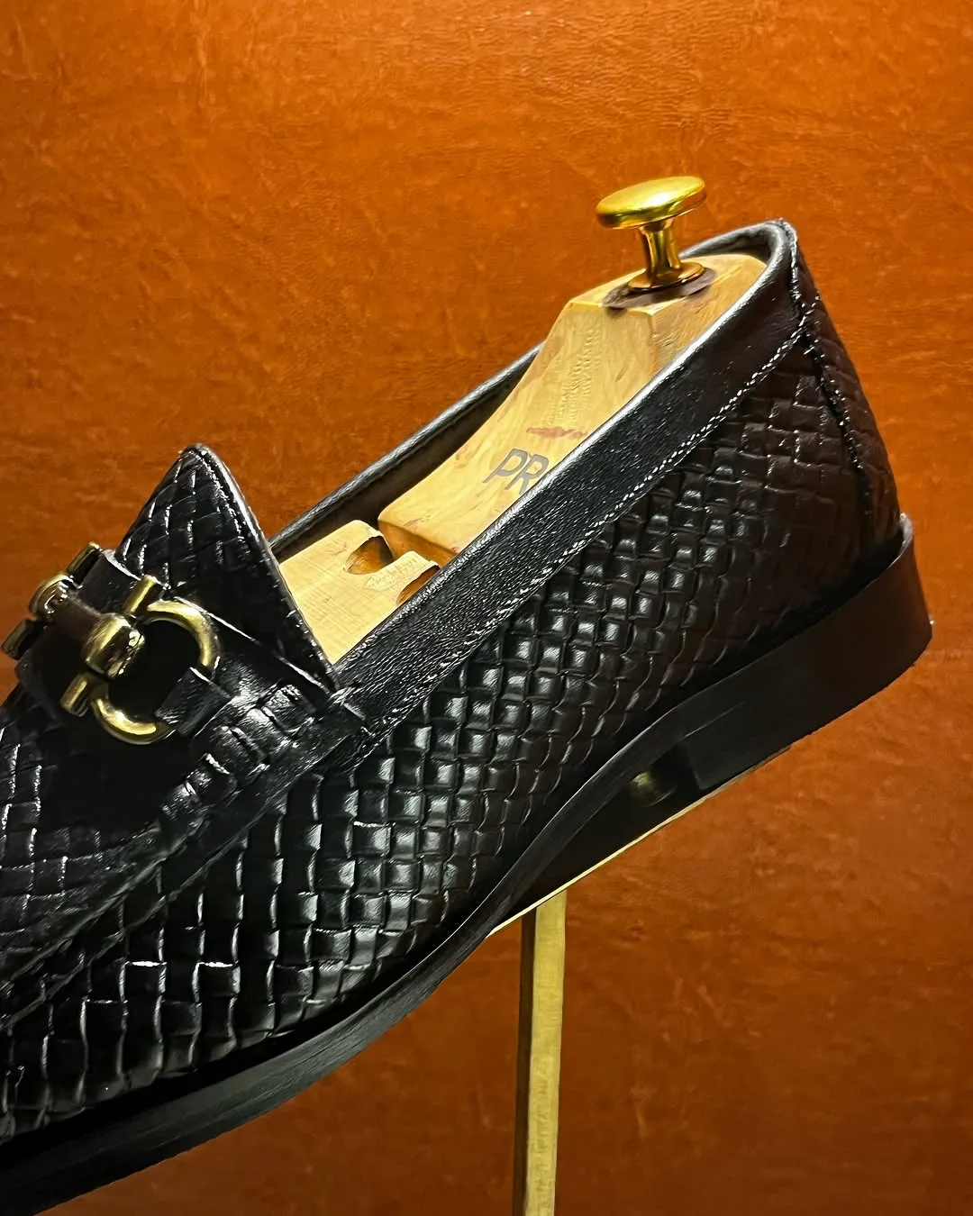 Elegant Black Woven Leather Loafer with Gold Bit Detail