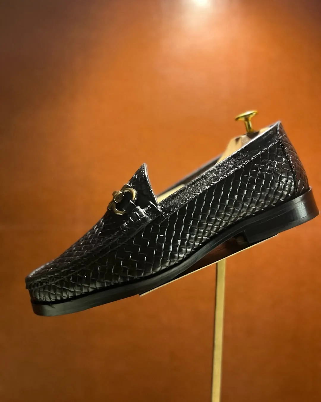 Elegant Black Woven Leather Loafer with Gold Bit Detail