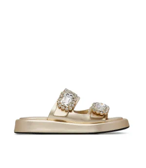 Mules in pelle oro con broche gioiello
