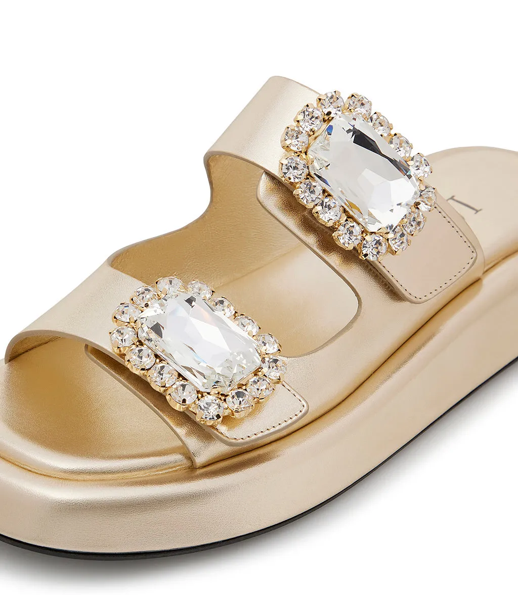 Mules in pelle oro con broche gioiello