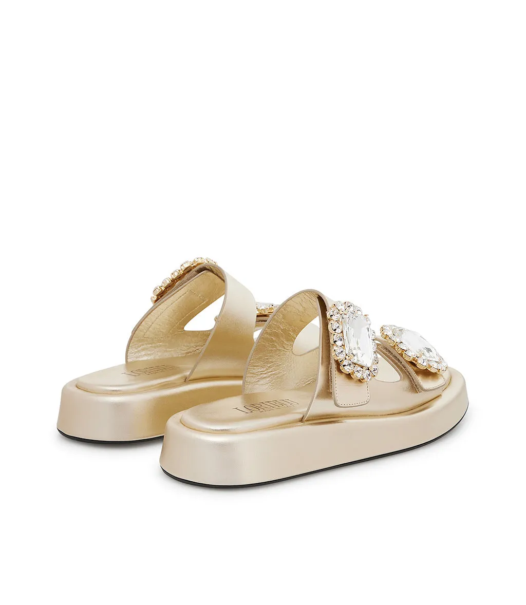Mules in pelle oro con broche gioiello